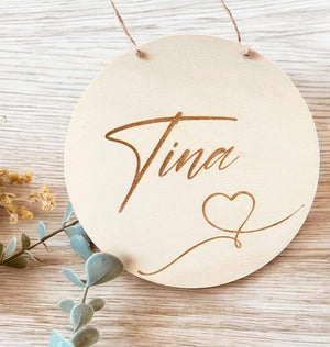 door sign with name and heart sign engraved